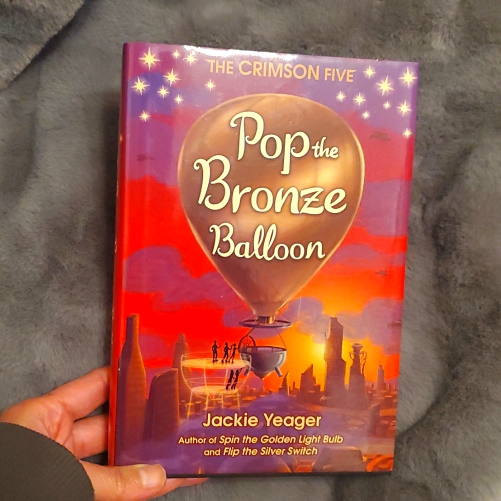 NWOT THE CRIMSON 5 "POP THE BRONZE BALLOON" By: Jackie Yaeger